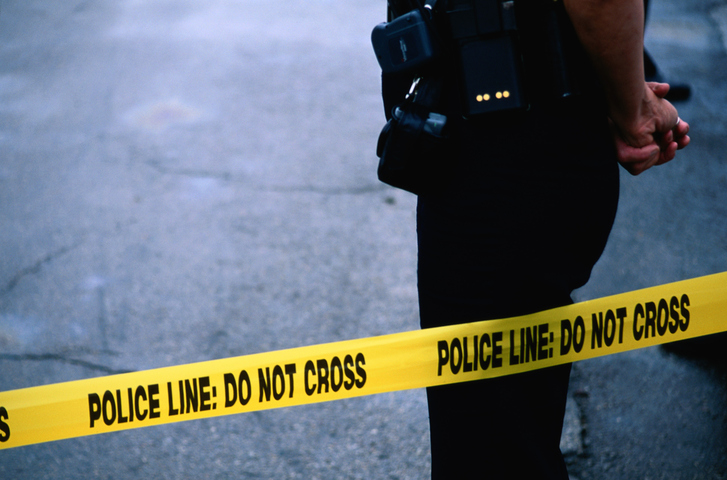 A police officer attends a crime scene.