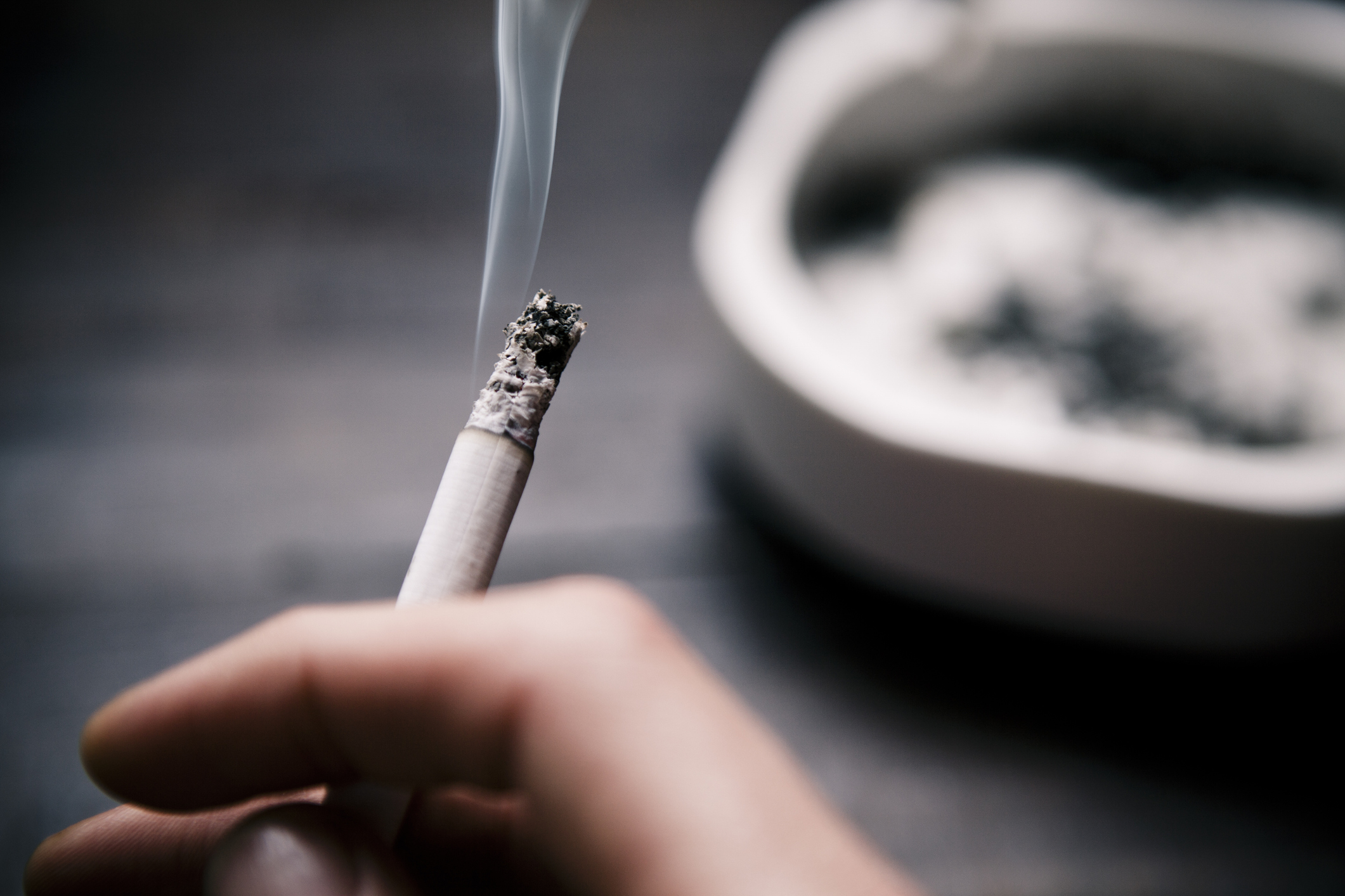 a lit cigarette burning