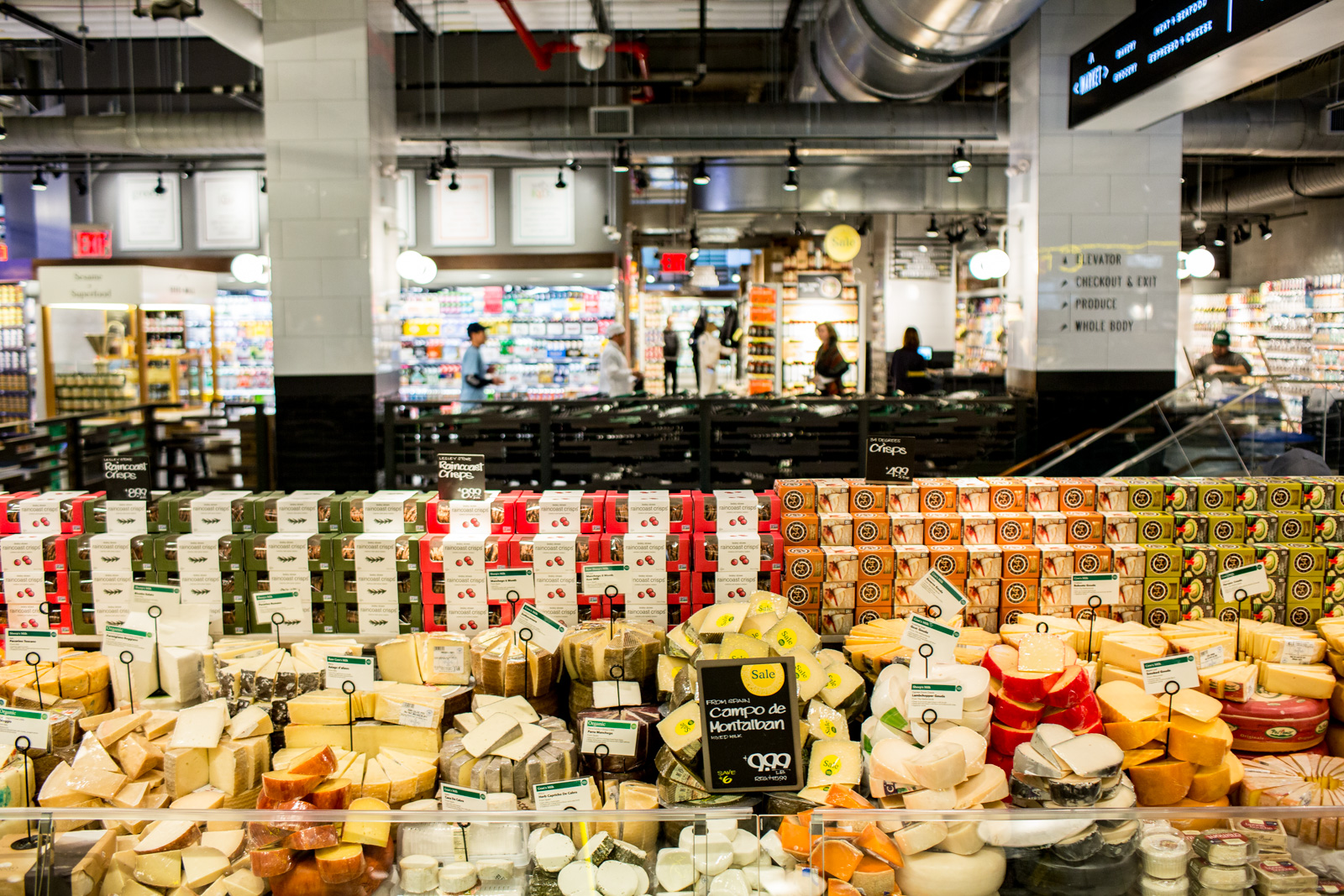 A shopper chooses cuts of meat in the new Whole Foods Market opposite  Bryant Park in New York on opening day Saturday, January 28, 2017. The  store in Midtown Manhattan is the