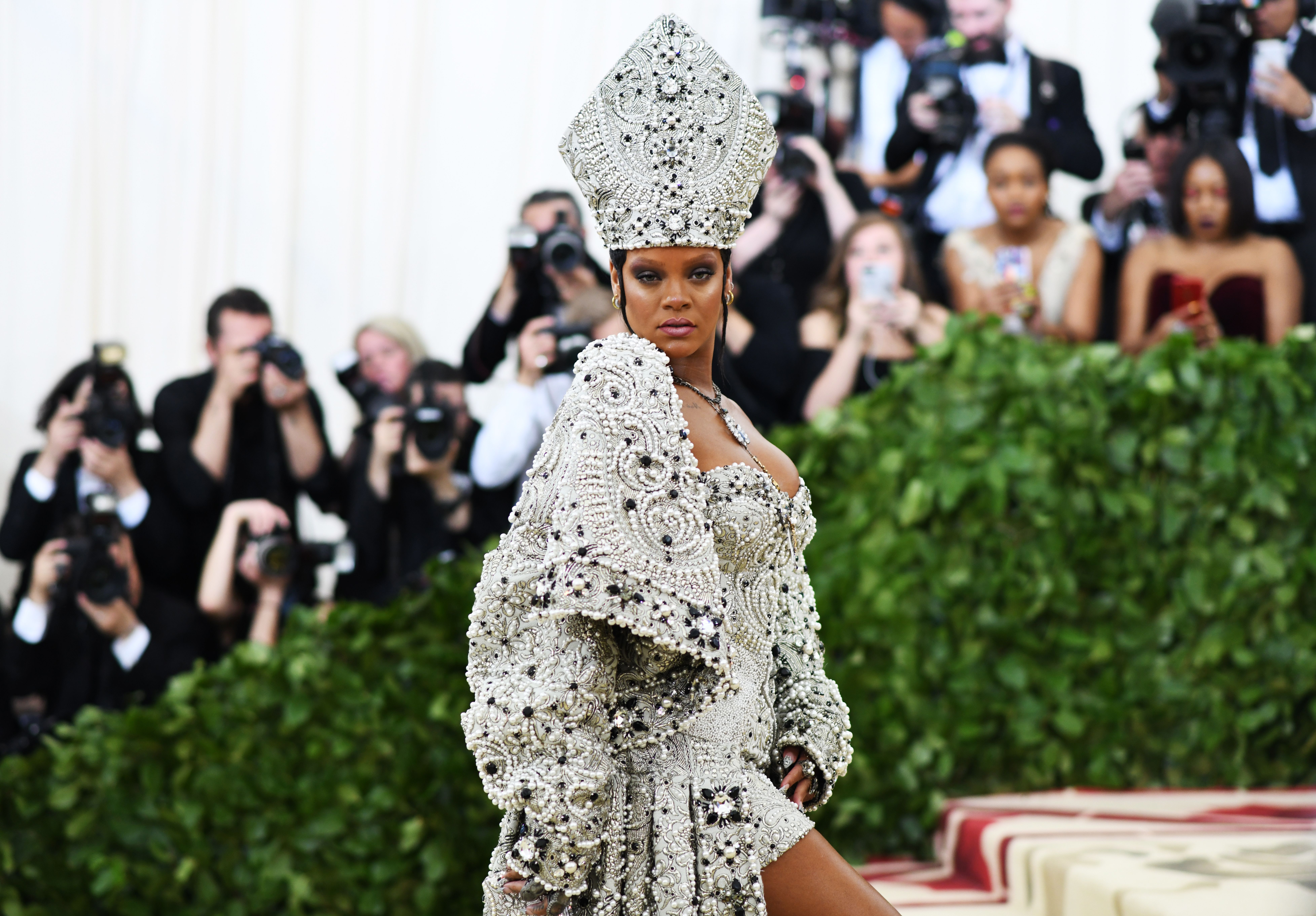 Photos: Trains, Halos, And Rihanna As The Pope At 2018 Met Gala