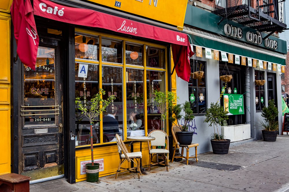 A table and two chairs outside of a restaurant
