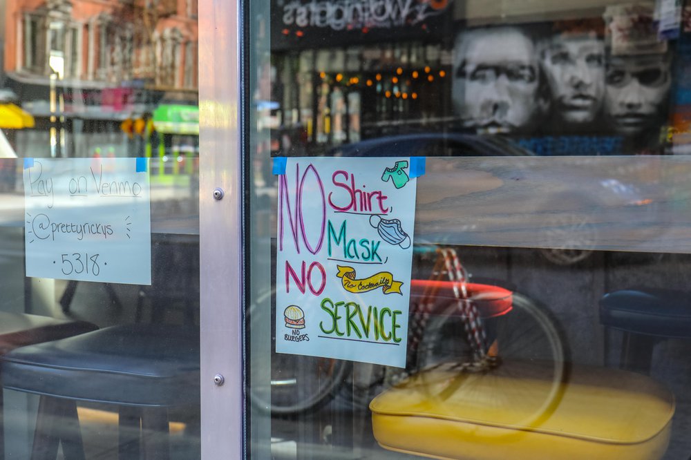 A sign reads: no mask no service