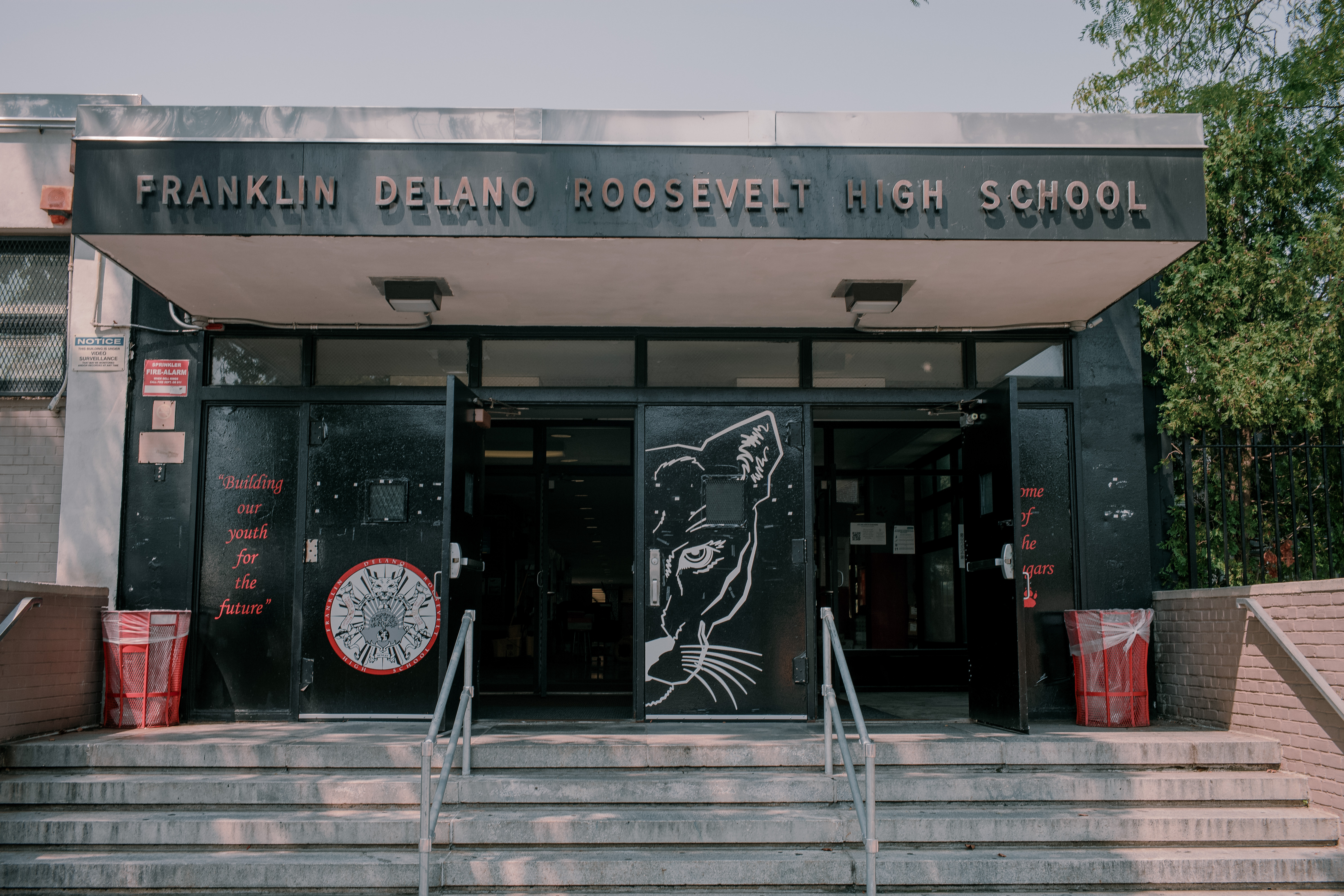The exterior of FDR High School in Brooklyn, featuring its windows and air conditioning units