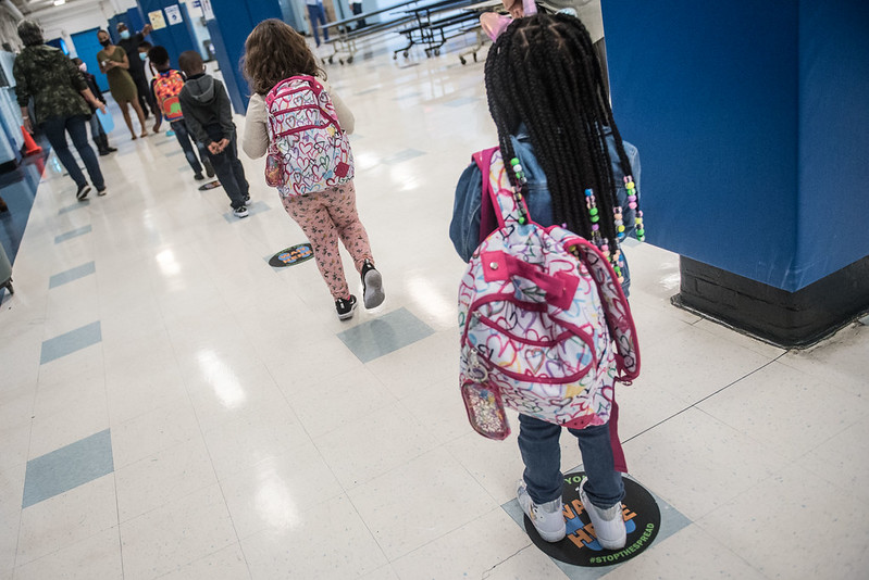Elementary school students stand on a line inside P.S. 188 in Manhattan.