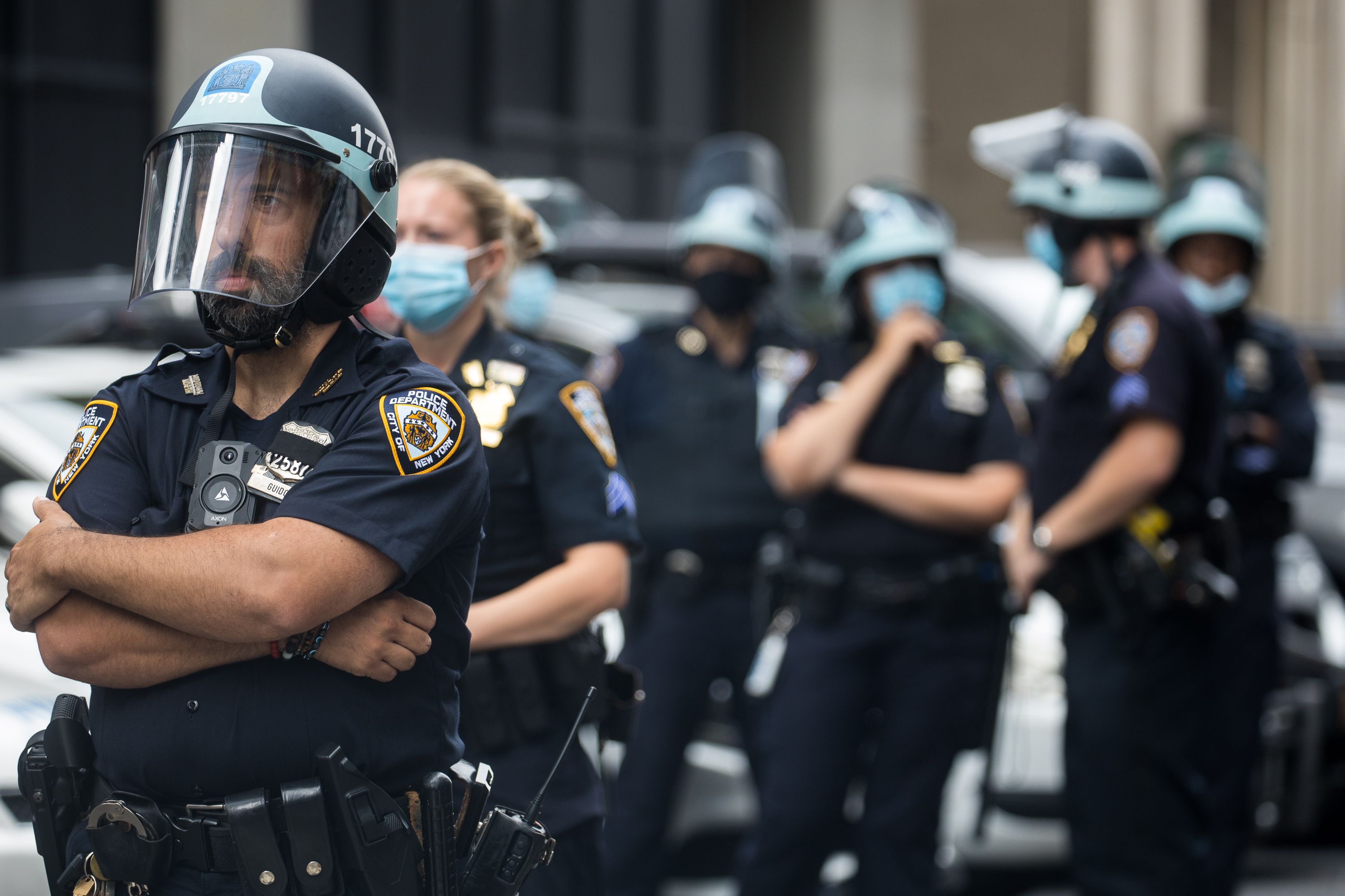 NYPD Police Officers stand in front of the in Midtown North Precintct on West 54th Street.