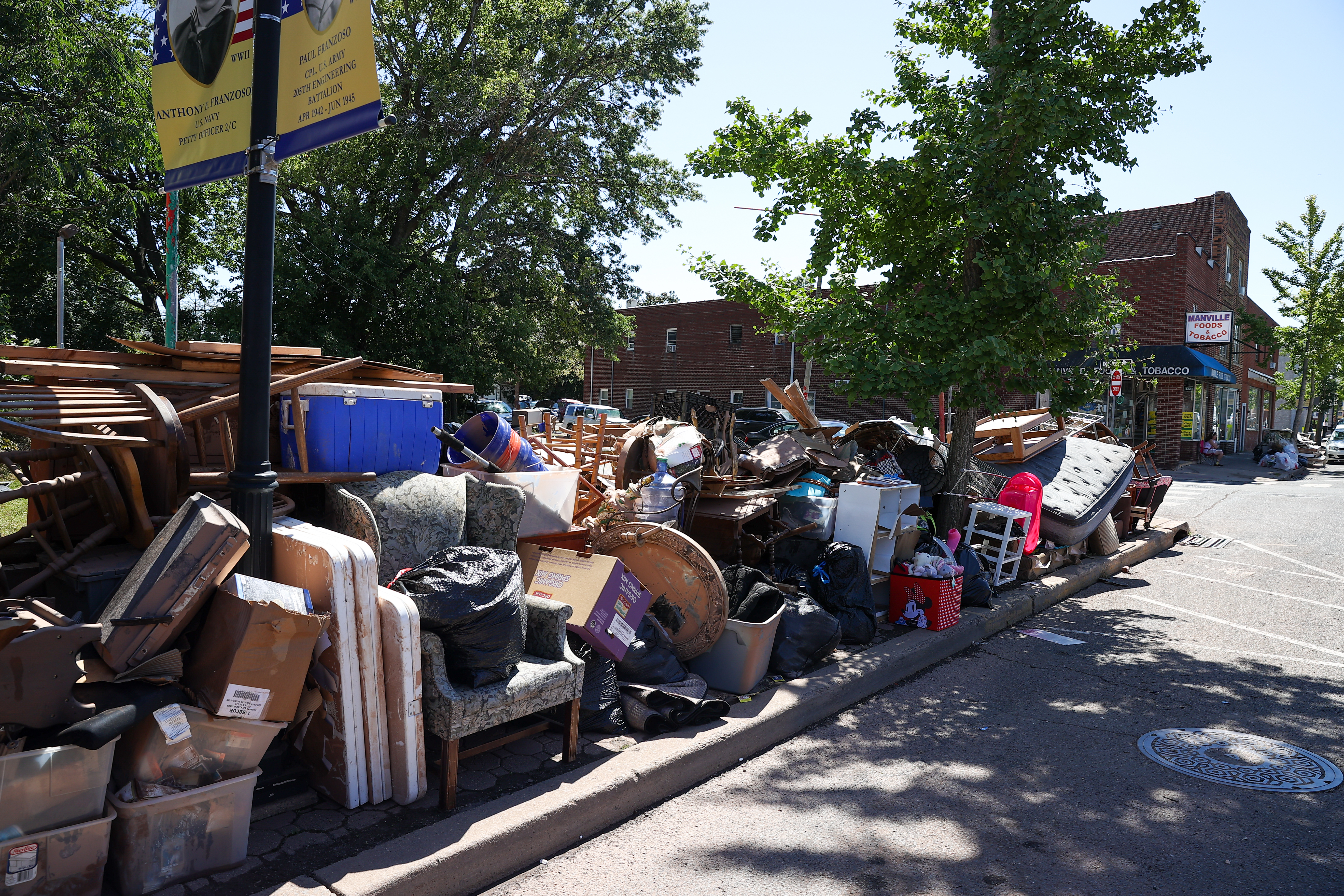 Residents left their belongings on the sidewalk after heavy rain and storm from remnants of Hurricane Ida in Manville, New Jersey in early September, 2021. Fewer than 200 New Jersey residents have received the extended housing aid from FEMA that advocates say they're entitled to.