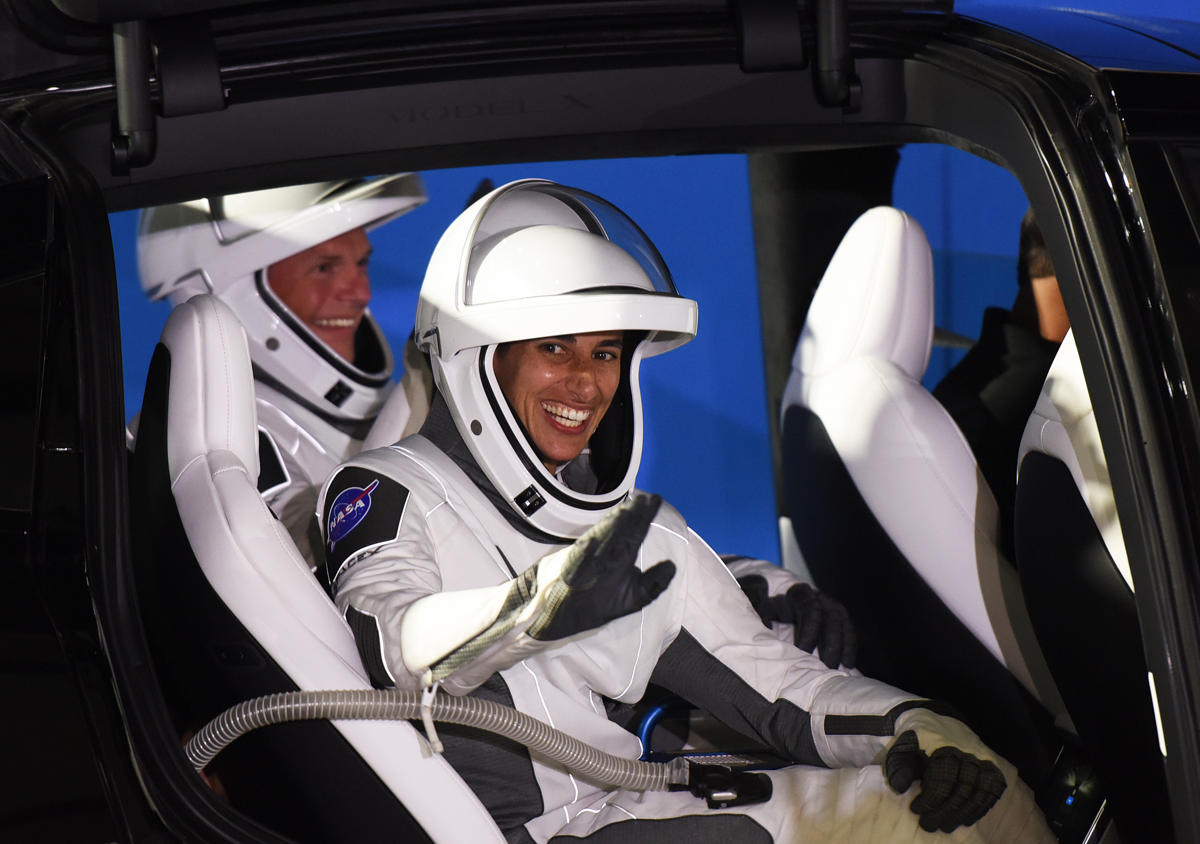 Crew-7 members European Space Agency astronaut Andreas Mogensen (L) and NASA astronaut Jasmin Moghbeli wave to family members before riding to pad 39A at the Kennedy Space Center for the launch of the SpaceX Falcon 9 Crew-7 mission.