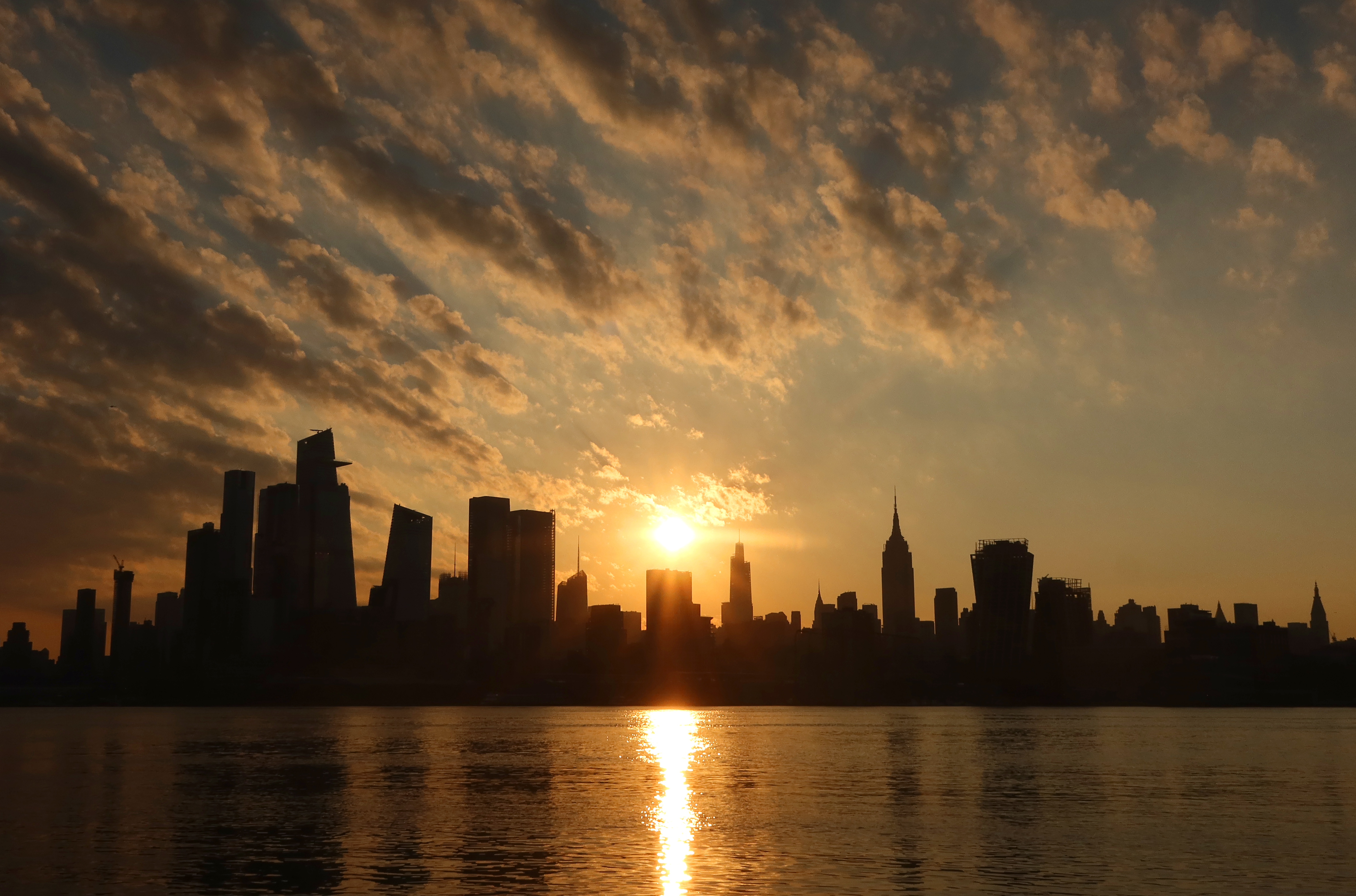 A photo of the sunrise over Manhattan on August 4, a day of record-breaking heat