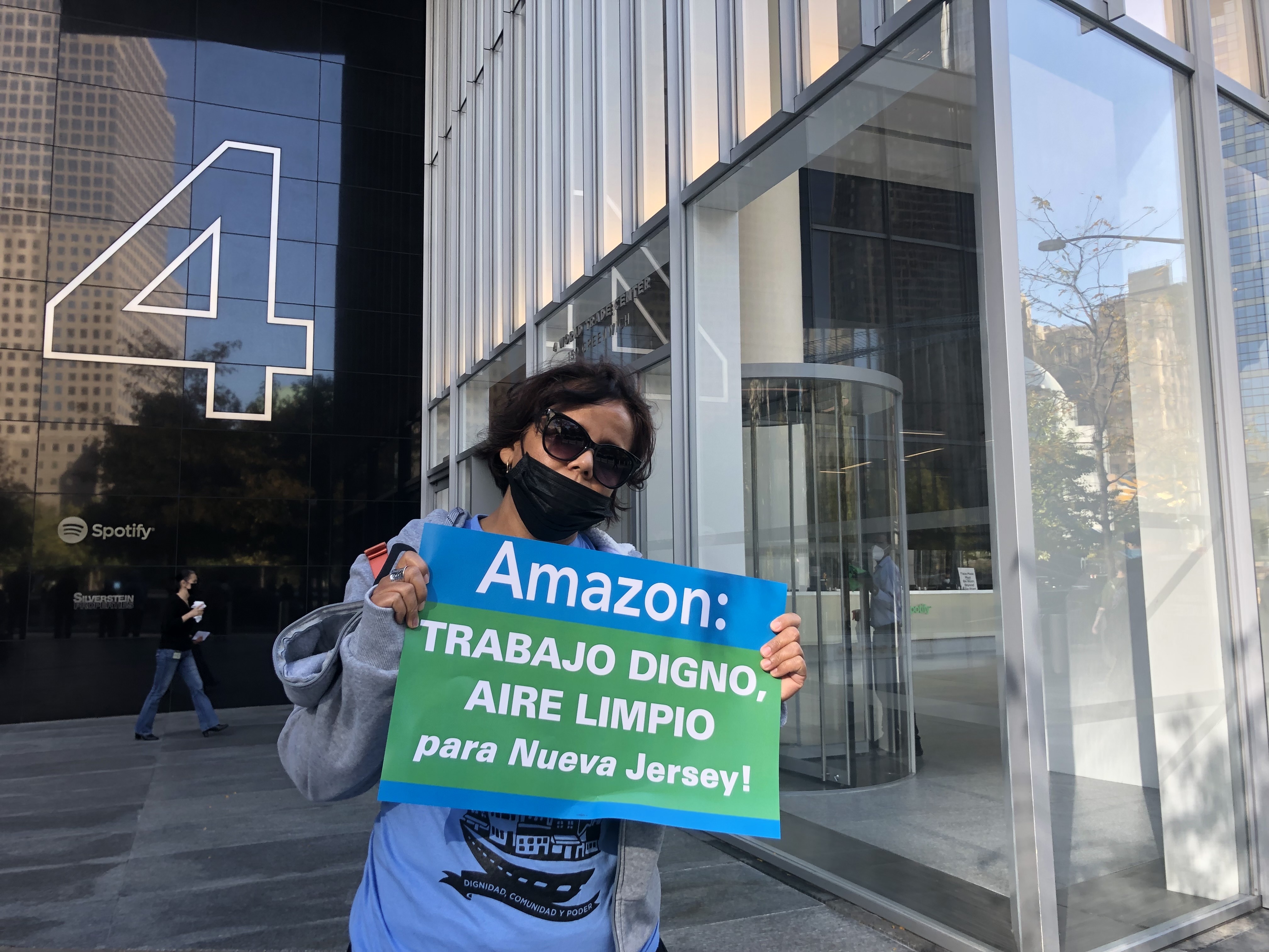 A member of Make the Road New Jersey protests a deal, then under consideration, to bring an Amazon hub to Newark airport on October 21, 2021. The deal has since been scrapped.