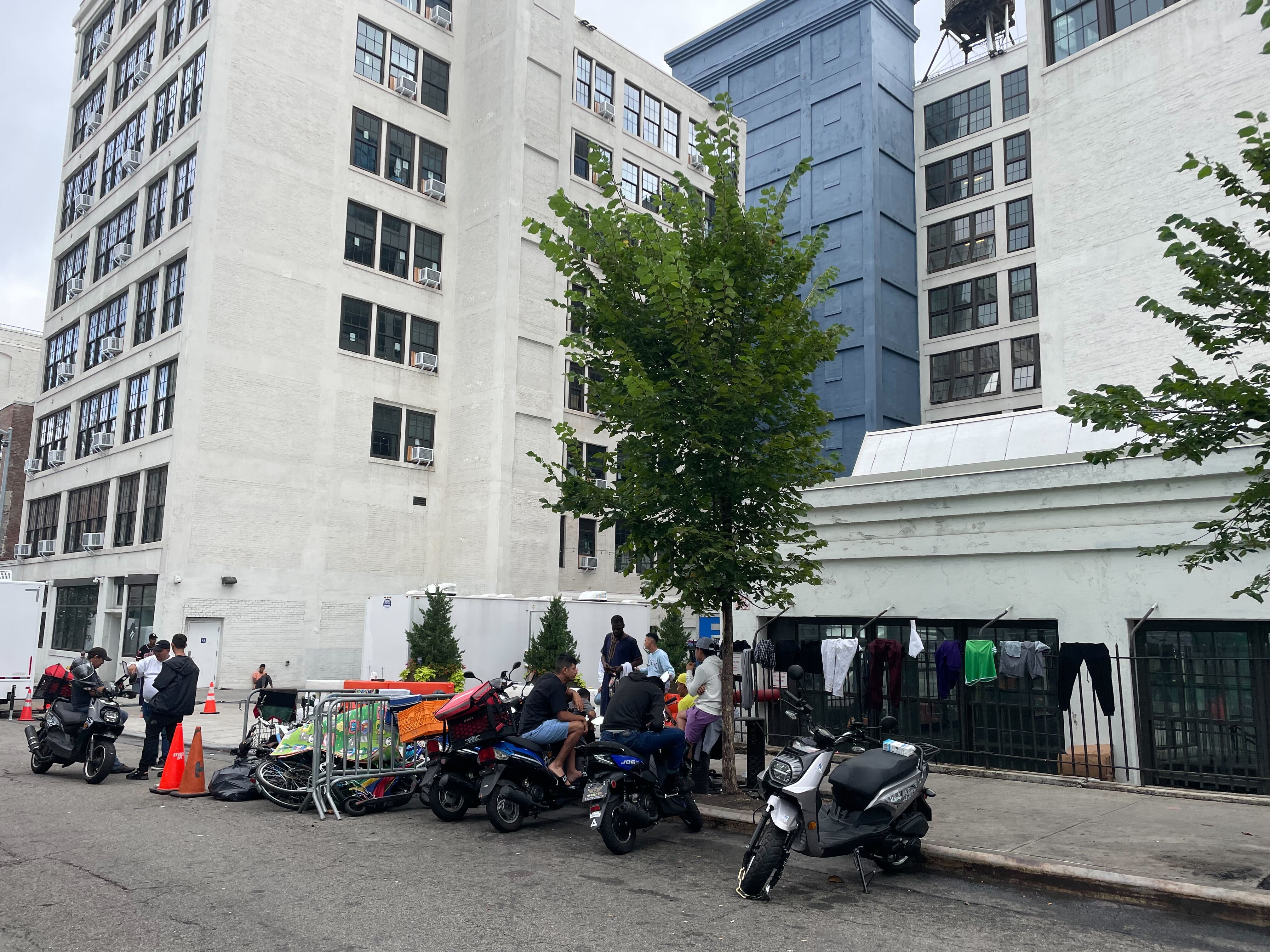 Restaurant owner drove car into men at Brooklyn migrant shelter, prosecutors say