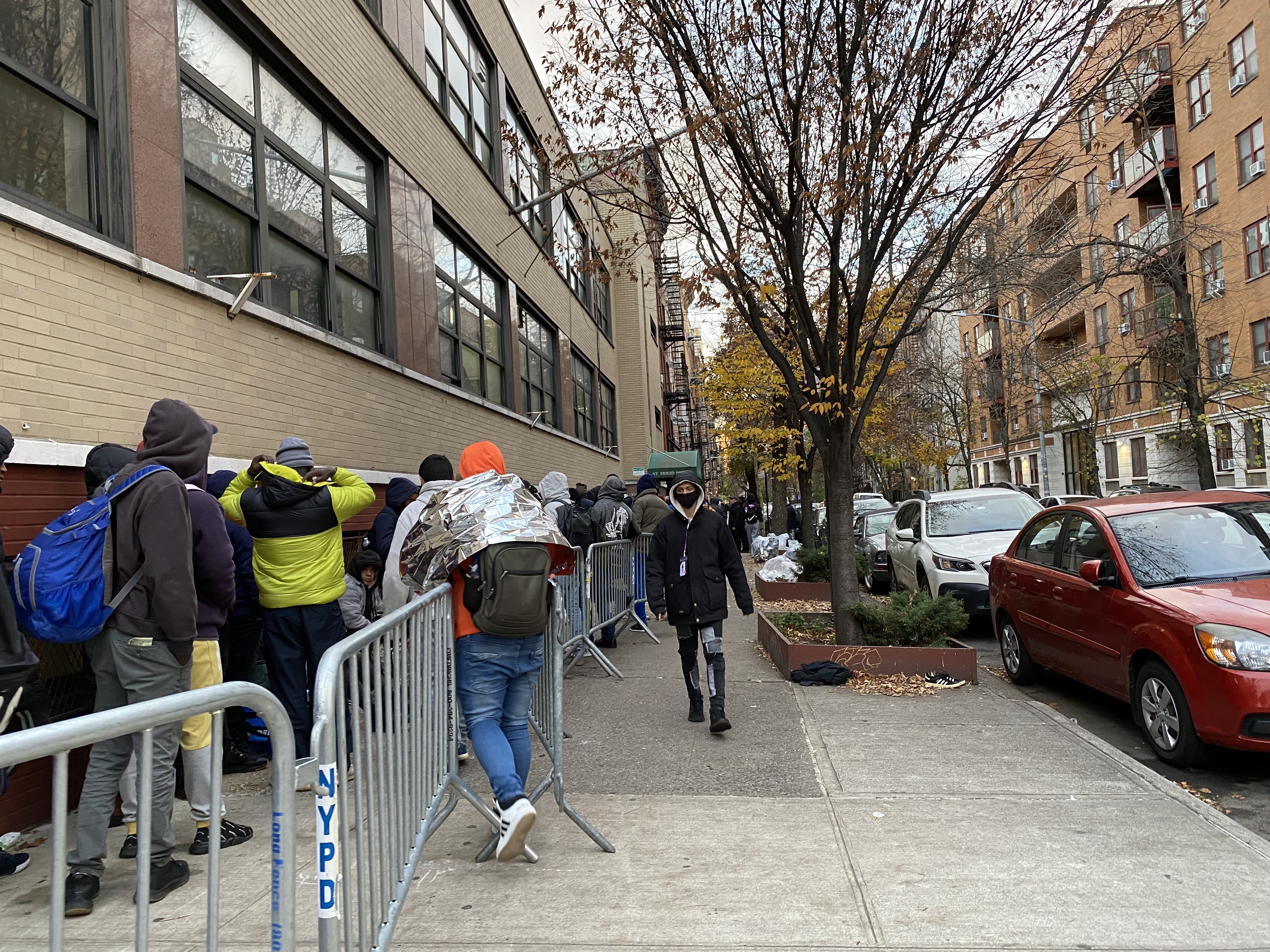 Hundreds of migrants wait hours in freezing NYC temps for an open shelter bed