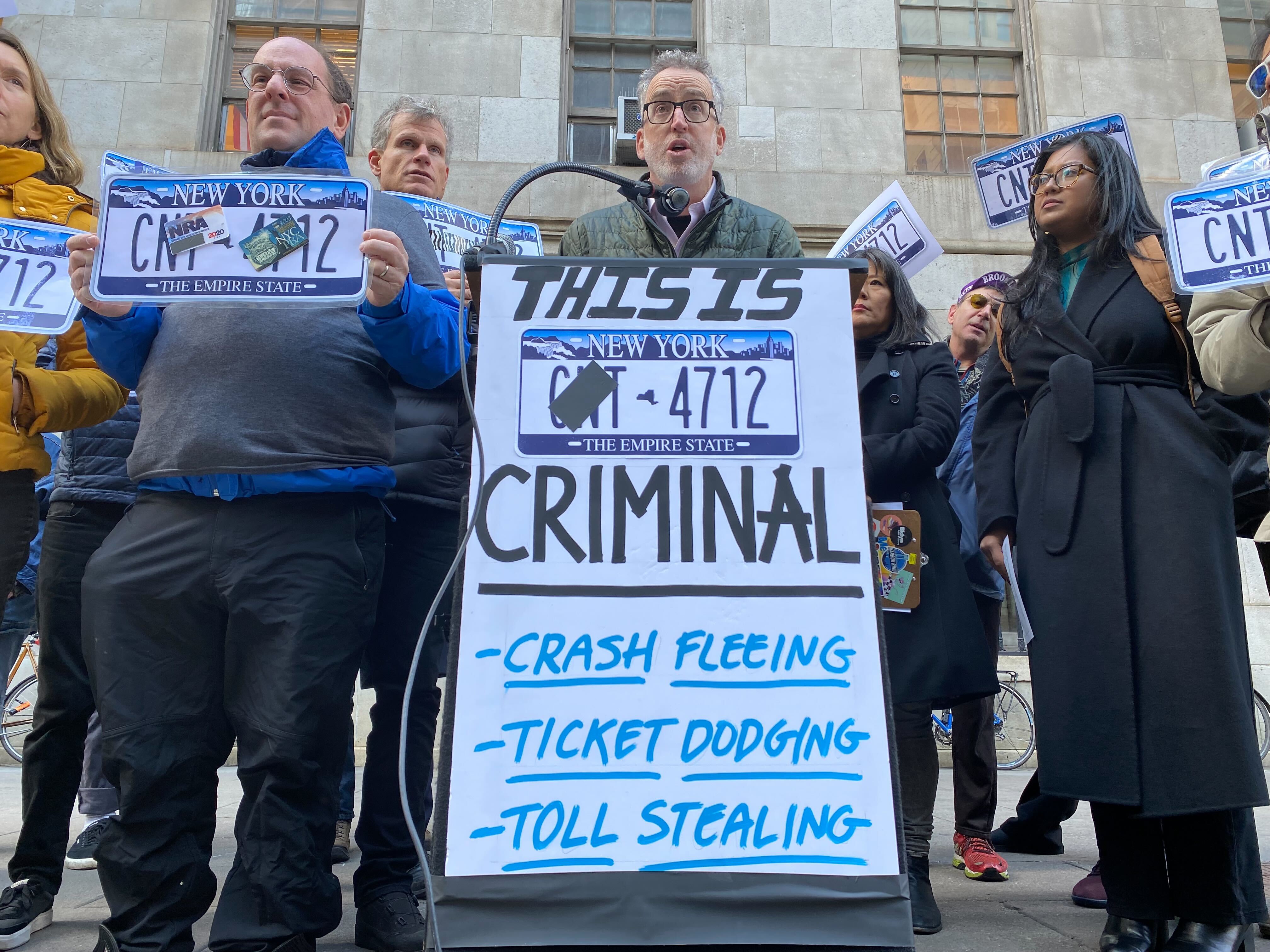 Street safety advocates rally against New York City drivers who hide their license plates from automated enforcement cameras.