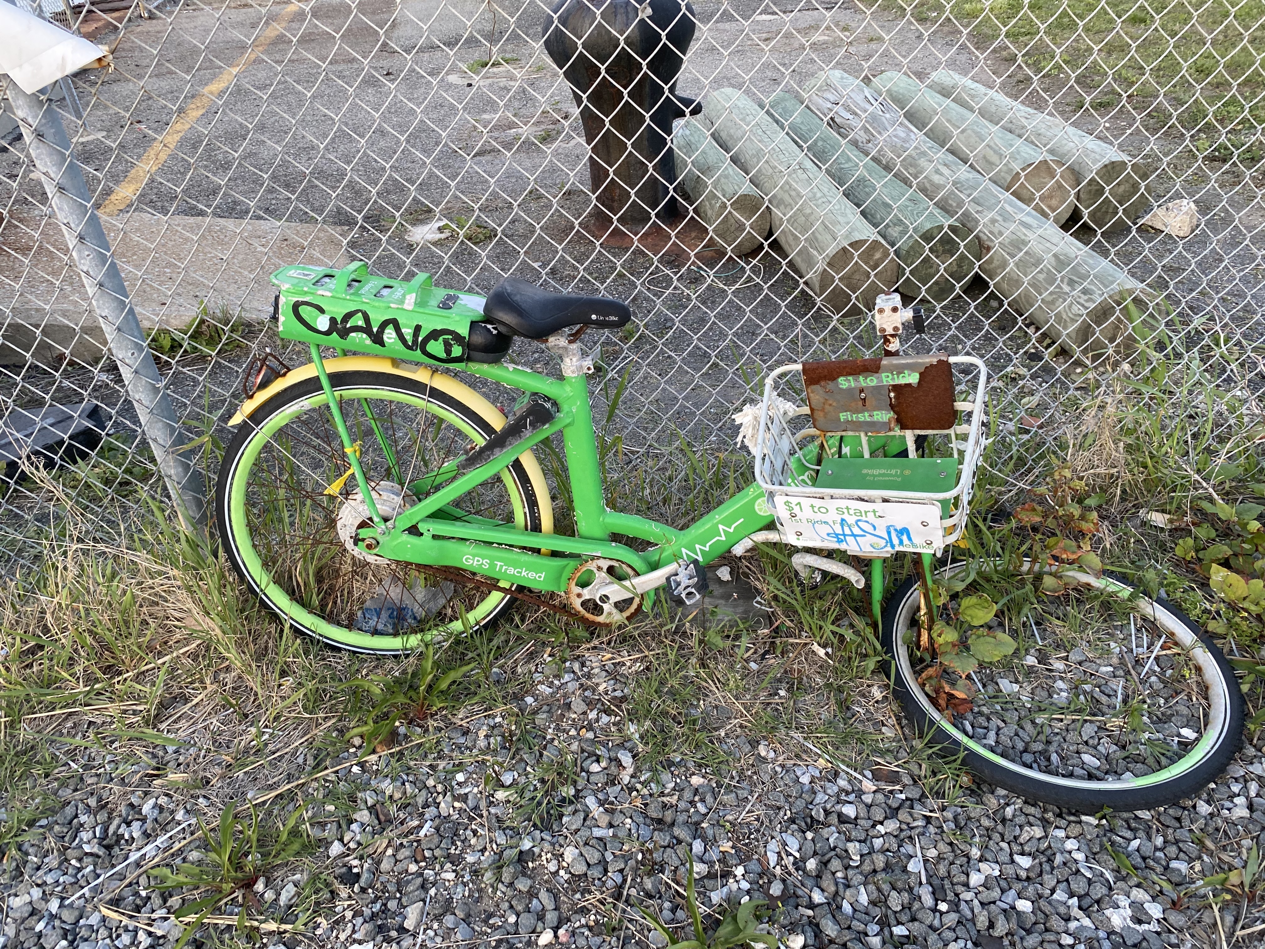 A broken down Lime bike on Rockaway beach
