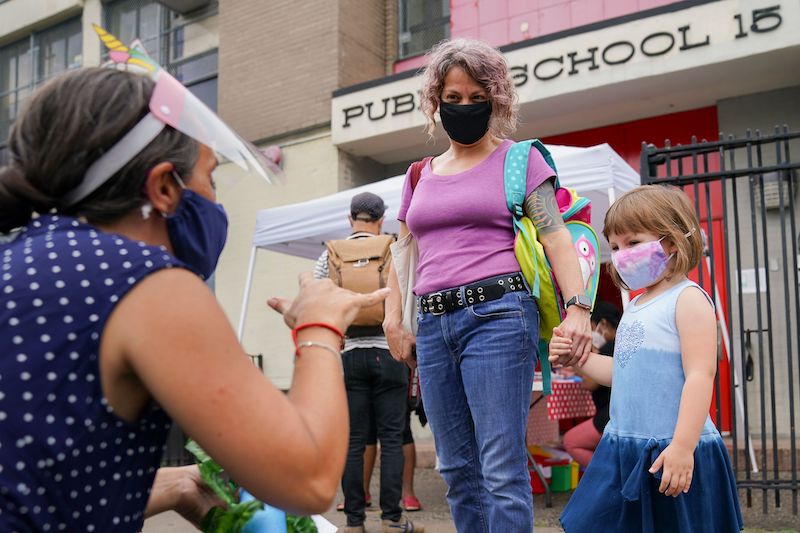 Teachers and students participate in an outdoor learning demonstration to display methods schools can use to continue on-site education during the coronavirus pandemic, at P.S. 15 in the Red Hook neighborhood of the Brooklyn.