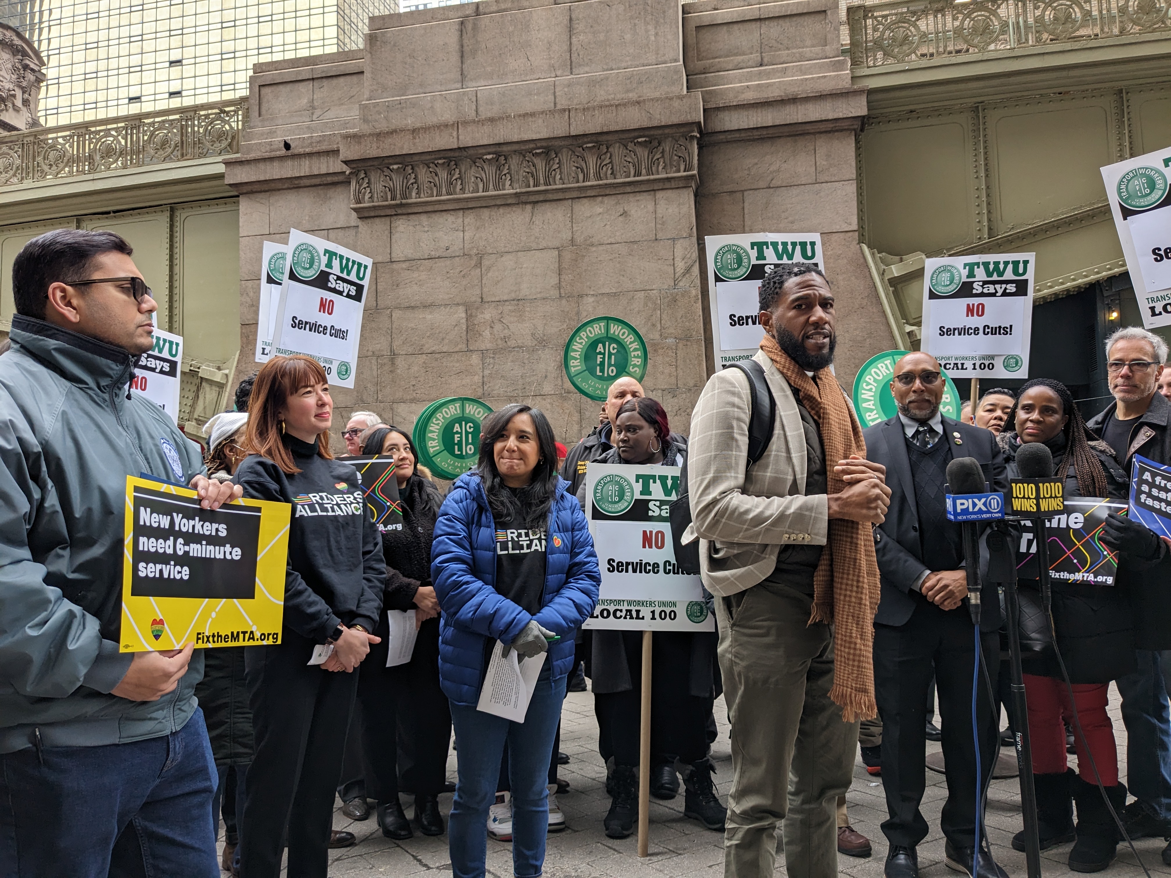 Transit advocates rally for quicker subway service on Wednesday, Feb. 22, 2023.