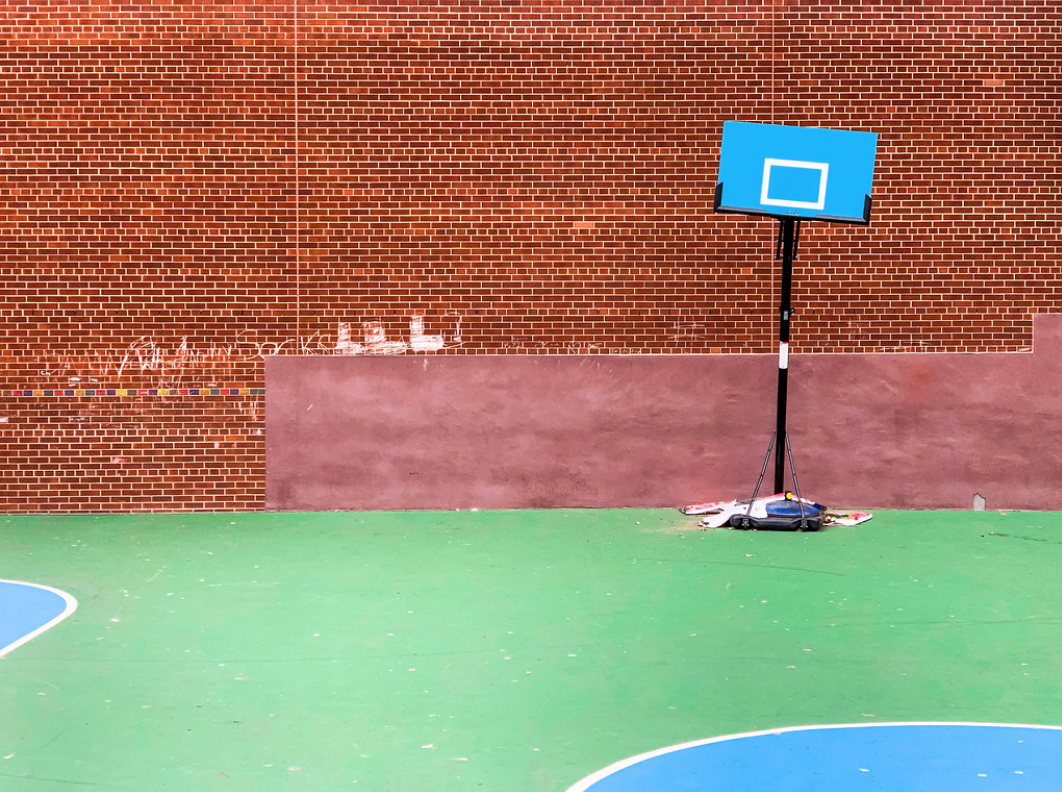 A photo of a basketball hoop taped to the ground