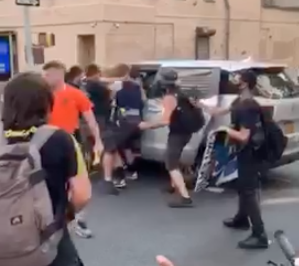Video shows NYPD officers throwing a protester into an unmarked van on Tuesday night