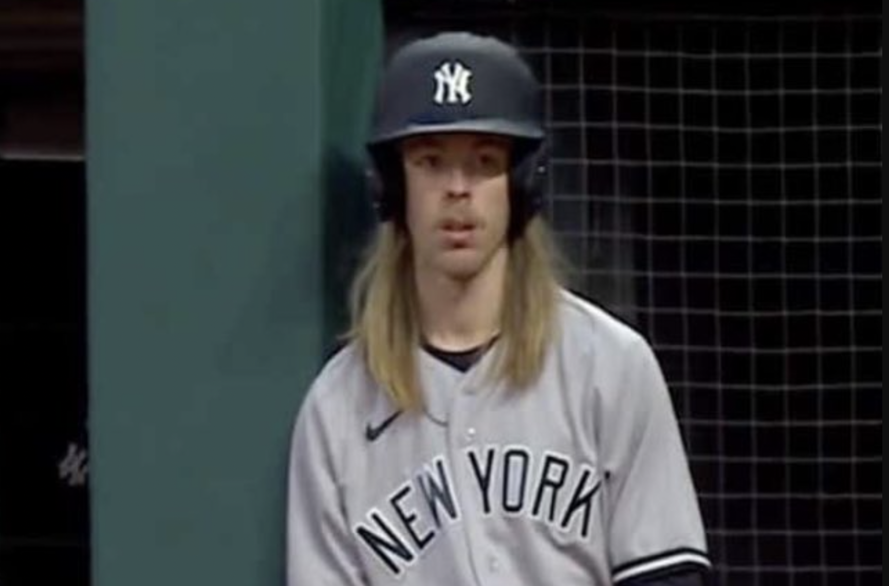 Extra Extra: Protect the luscious locks of this Yankees bat boy Extra Extra: Protect the luscious locks of this Yankees bat boy