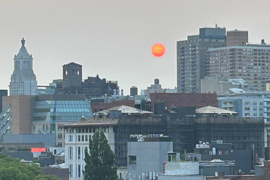 Canadian blazes give New York-area skies a fiery sunrise and smoky haze