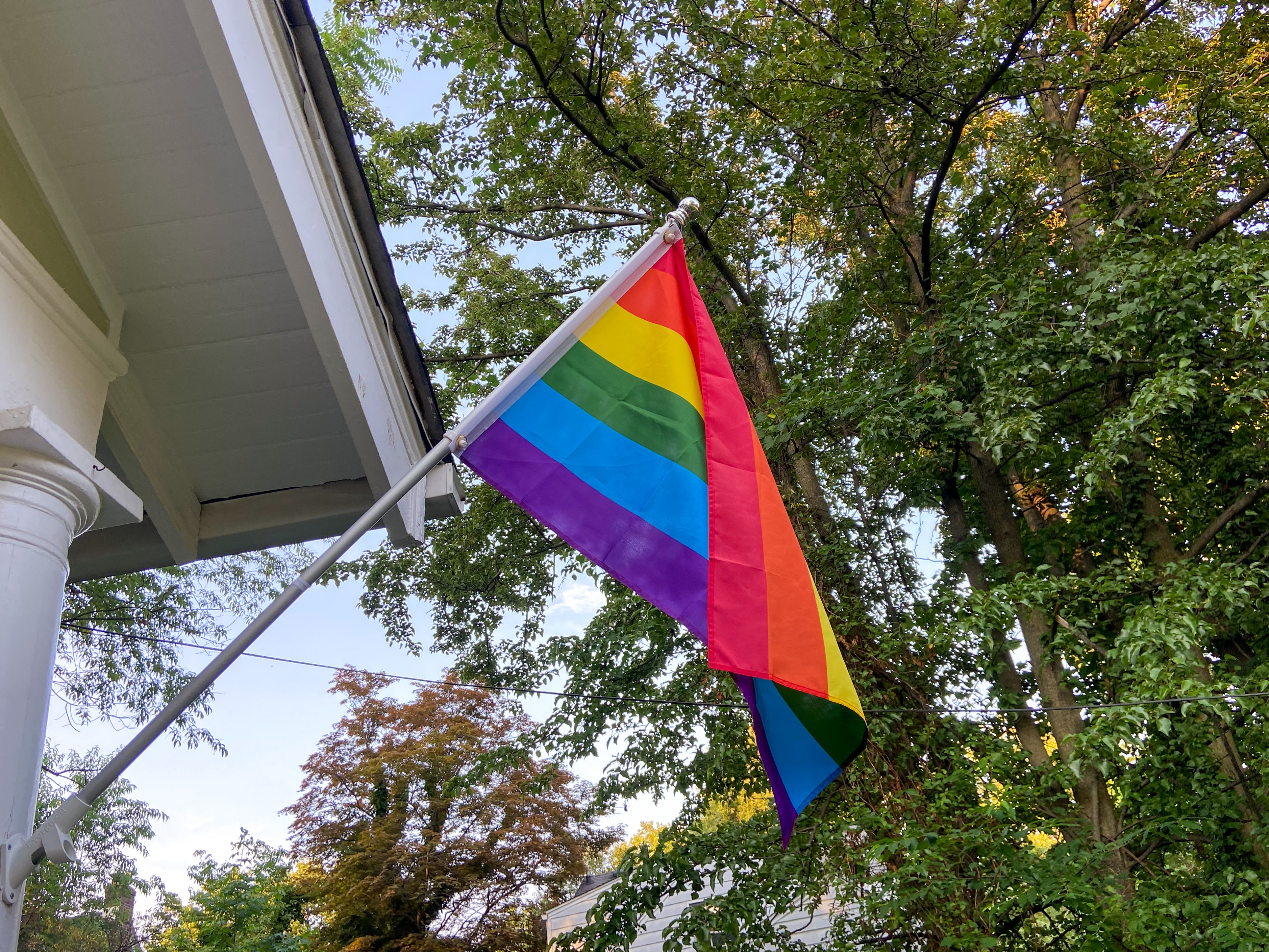 A photo of a Pride flag hanging outside a New Jersey home.