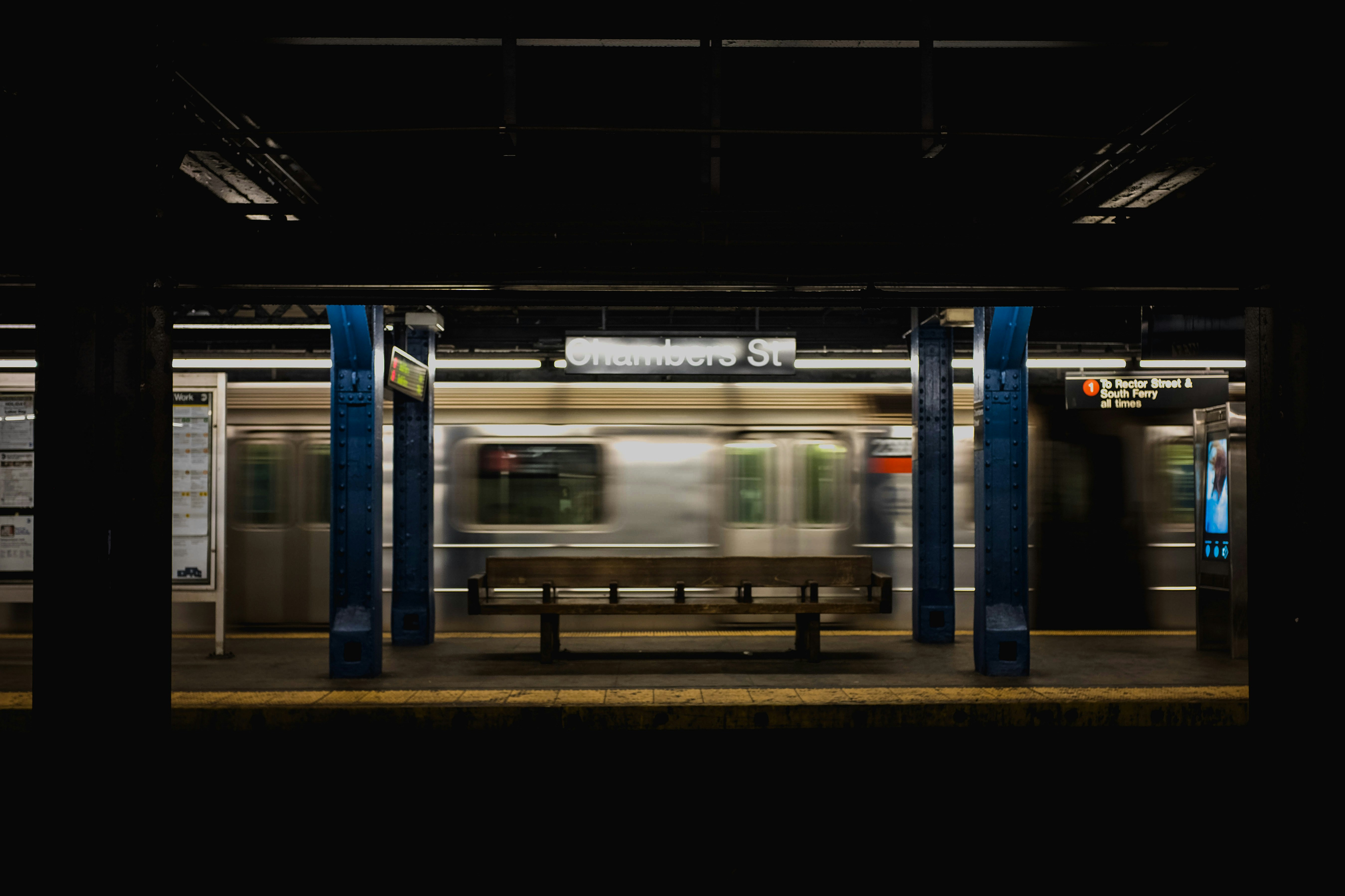 A subway passes through the Chambers Street station.
