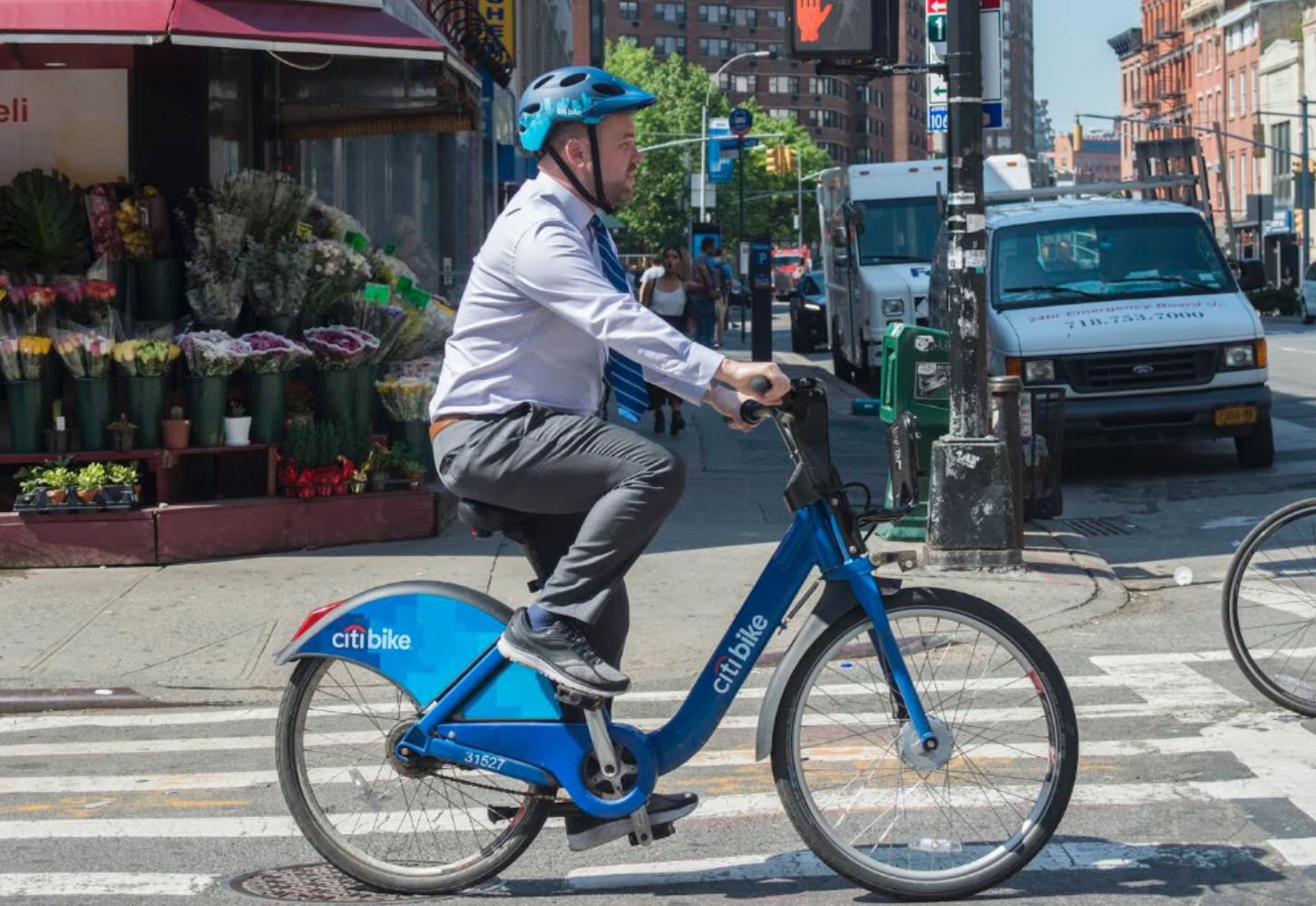Former New York City Council speaker Corey Johnson riding a Citi Bike.