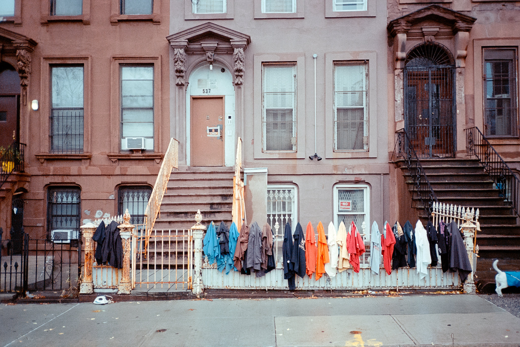 t-shirts hanging outside a brownstone
