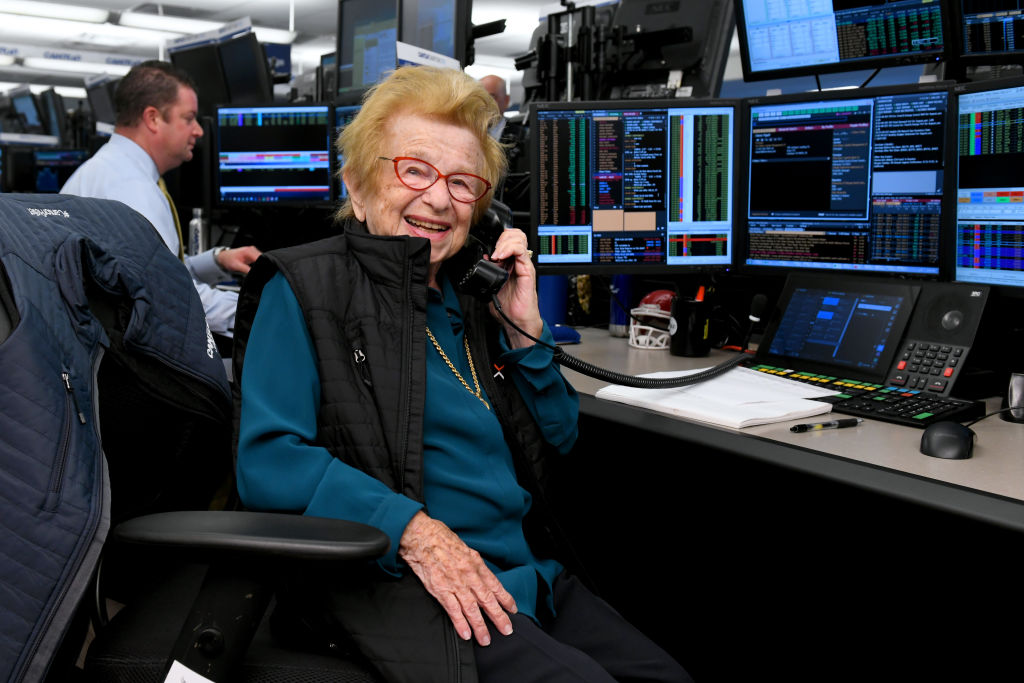 Dr. Ruth smiling on the phone