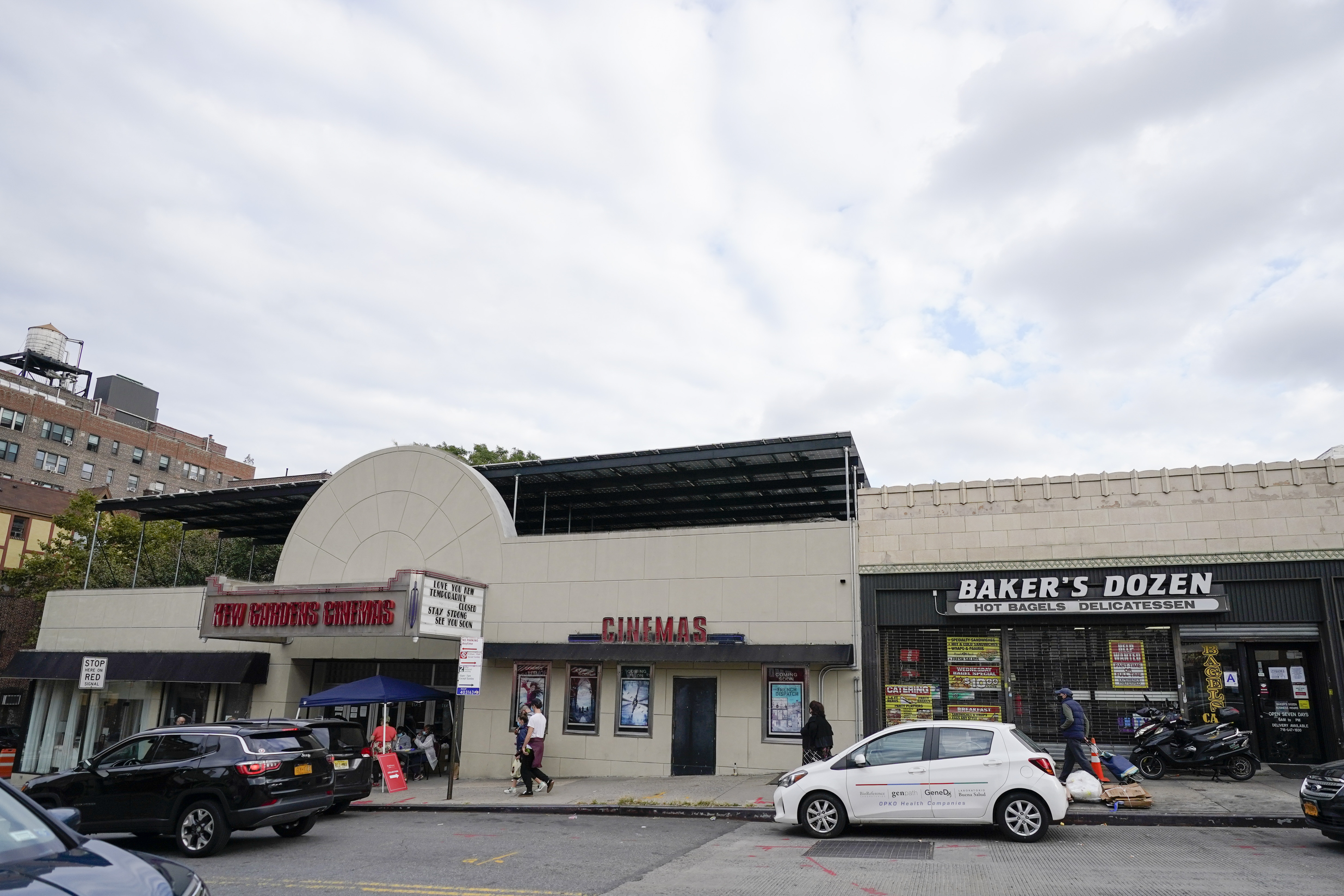 Pedestrians pass businesses on Lefferts Blvd., in Kew Gardens, Queens on October 5th, 2020.