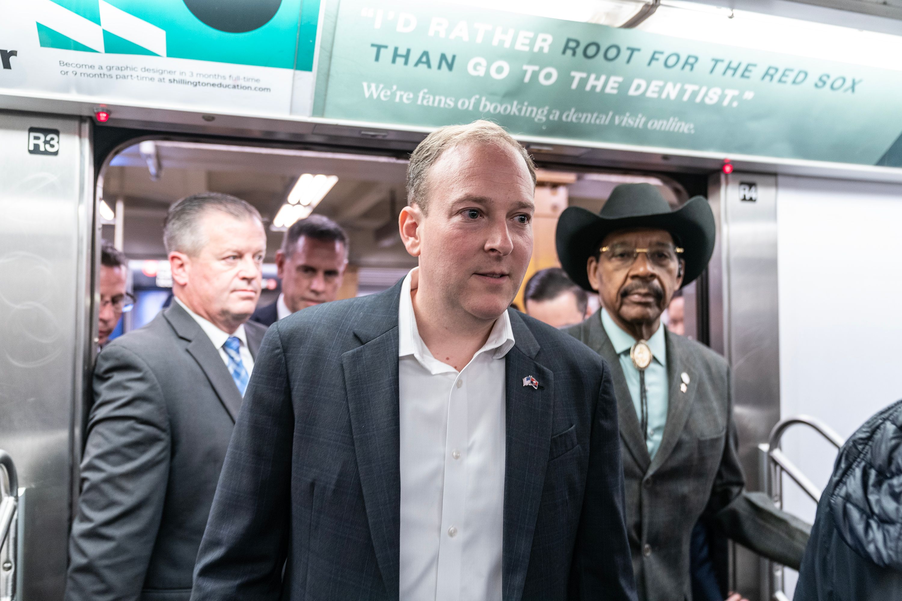 Rep. Lee Zeldin, candidate from Republican Party for governor on general election, rides subway to debates with incumbent Kathy Hochul. Zeldin speaks to the press while on board the train. The family of a man killed by the NYPD in 2018 wants the image of the man wiped from a recent campaign ad.