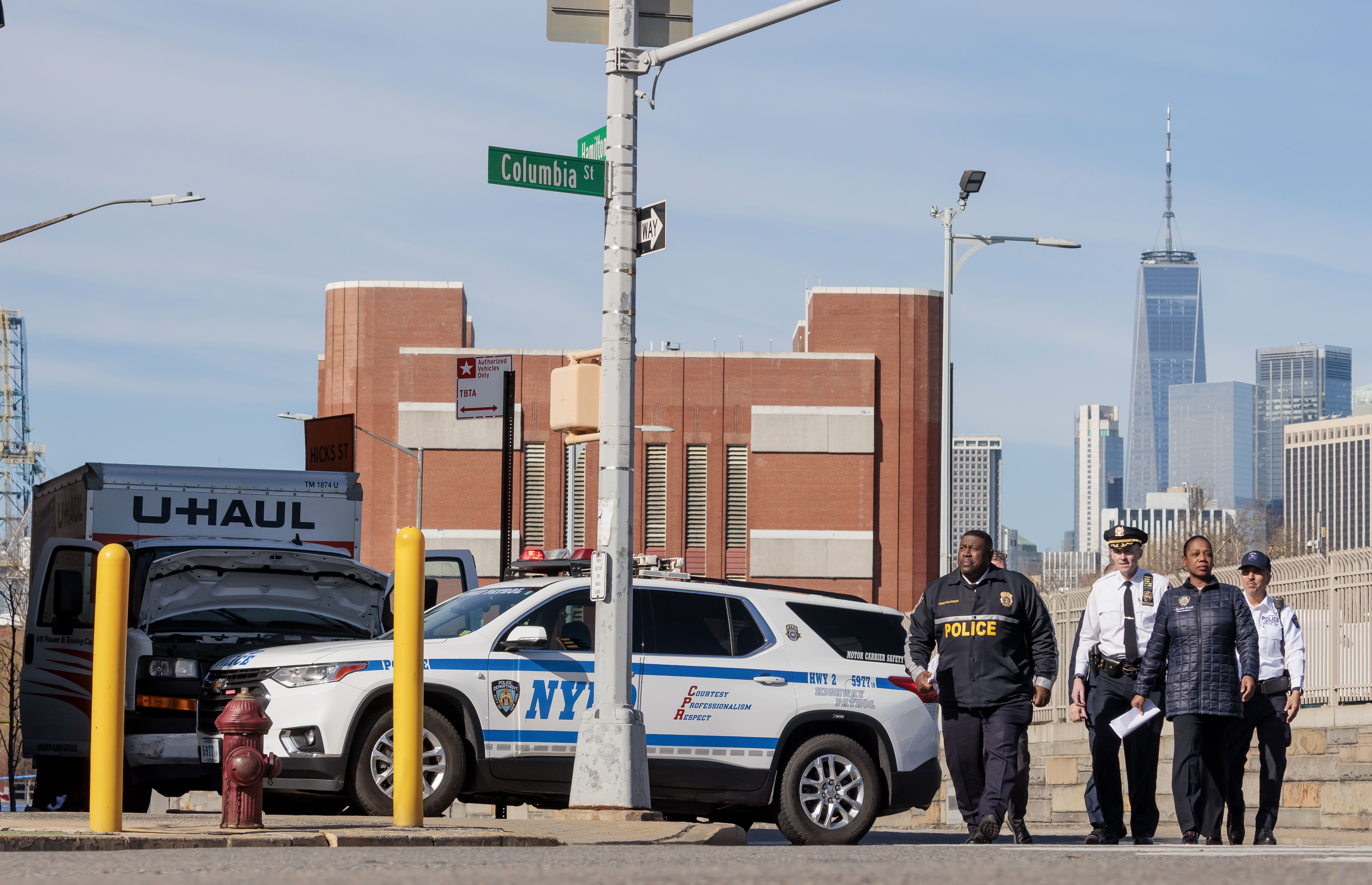 New York City Police Commissioner Keechant Sewell (2-R) arriving for a press conference on the scene where a U-haul moving truck (L) was stopped after running over multiple pedestrians in Brooklyn.