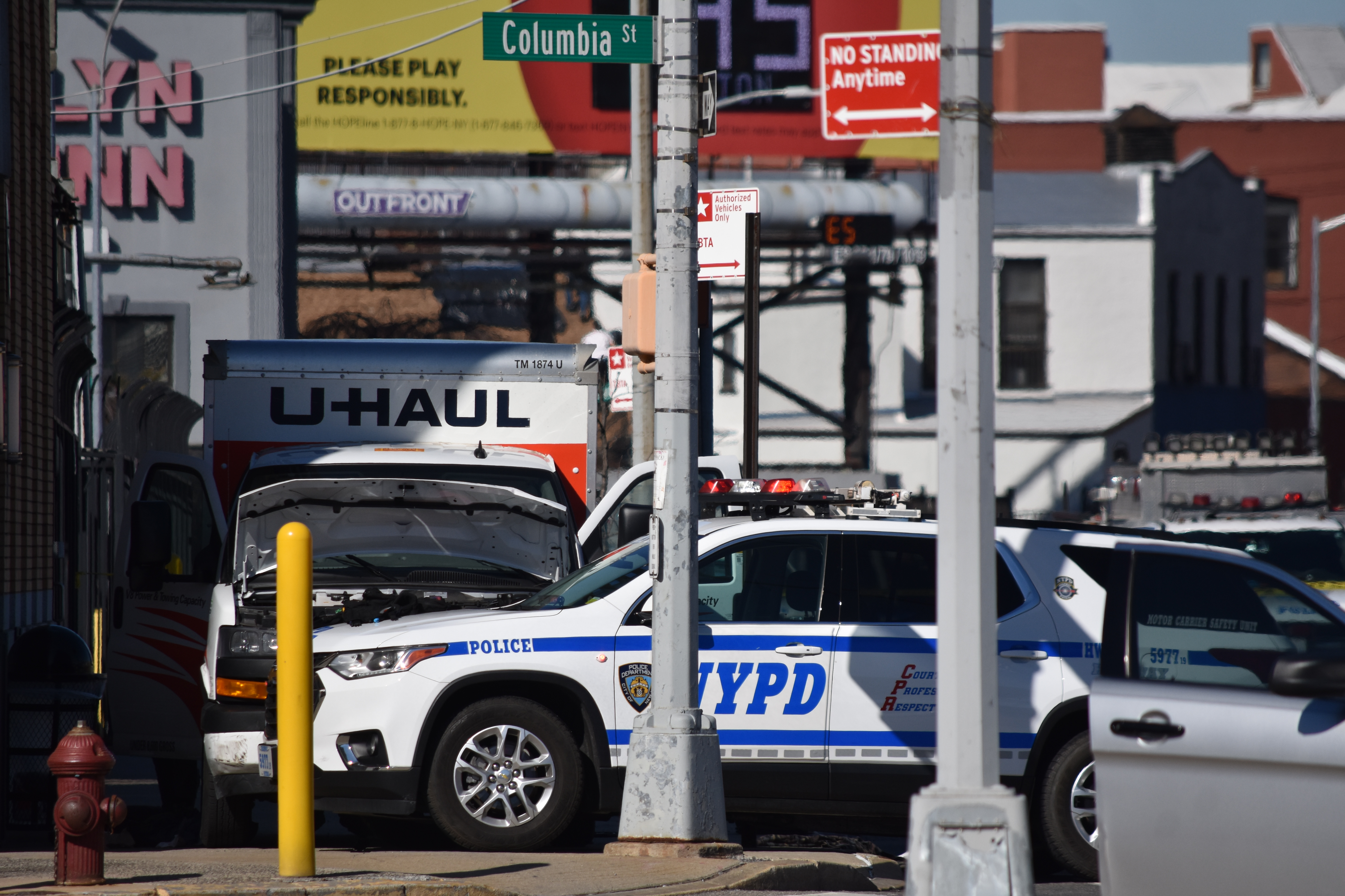Police investigate the scene where a driver rammed into several pedestrians in Brooklyn.