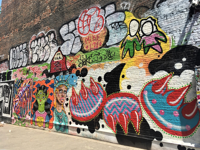 a wall of graffiti in new york city